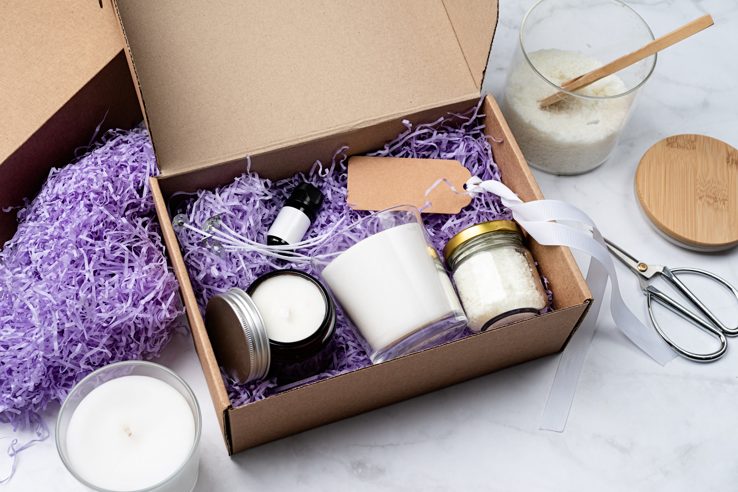 DIY craft kit with candle-making materials on linen